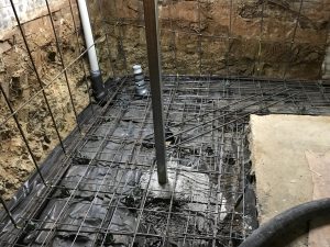 Undermining a house footing to create more space